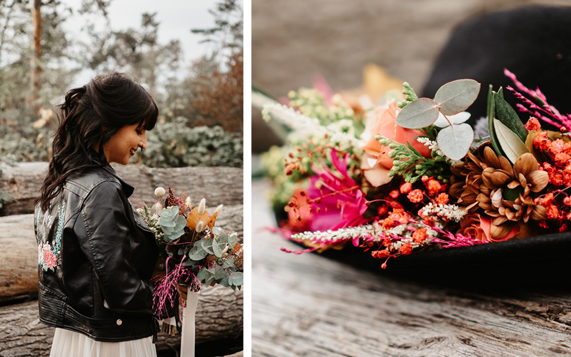 Die Braut hält den Brautstrauß aus bunten, leuchtenden Blumen in orange, pink und rostigen Tönen. 